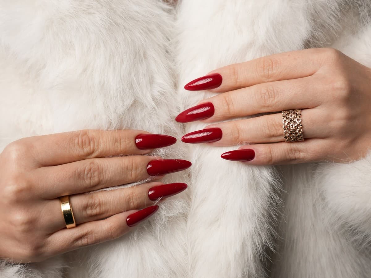 Nail technician performing a Russian manicure with an electric file at UNIQUE PERSONA Dubai